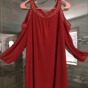 Women’s studded hollow shoulder blouse. Rust color